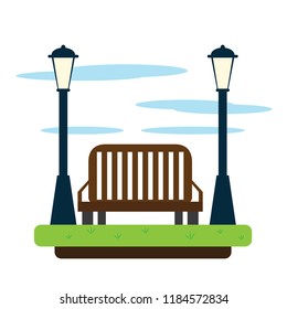 View of a public park with lamps and a bench
