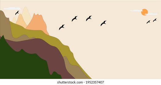 view of several mountain peaks from a distance with birds flying around in the afternoon with the orange sun