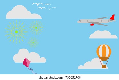 View of sky with airplane, kite, orange hot air balloon and fireworks with cloud in the blue sky