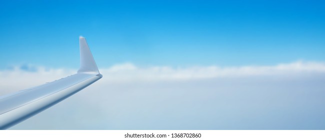 View of the sky and wing of the aircraft from the window. Time to travel. Air transport in the blue clear sky. Realistic vector 3d illustration for touristic and travel agency