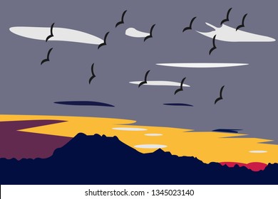 View of sunset and a flock of birds in the sky.