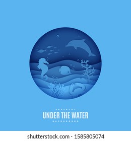 View of the underwater world through the porthole of a submarine in paper cut style. Vector papercut wave, tropical marine life in round frame. Craft underwater ocean diving concept. World Ocean Day