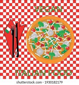 VIEW OF A VEGAN PIZZA WITH ONION, CHERRY TOMATOES, BASIL LEAVES AND
BROCOLI ON A RED AND WHITE CHECK TABLECLOTH WITH A BLACK CUTLERY AND A RED NAPKIN