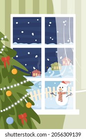 View from the window on a winter evening. Christmas tree, winter city. 