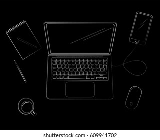 View of workplace with laptop on black background. From above view.