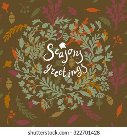 Vignette of colourful leaves, includes text Seasons greetings Vector illustration