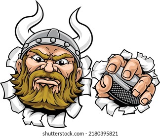 A viking hockey sports mascot cartoon character holding a puck