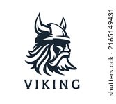 Viking logo design. Nordic warrior symbol. Horned Norseman emblem. Barbarian man head icon with horn helmet and beard. Brand identity vector illustration.
