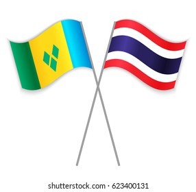 Vincentian and Thai crossed flags. Saint Vincent and the Grenadines combined with Thailand isolated on white. Language learning, international business or travel concept.