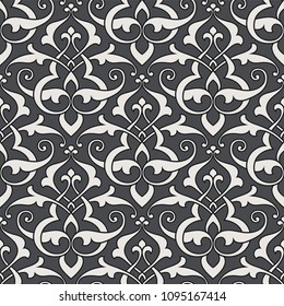 Vintage abstract floral seamless pattern. Intersecting stylized leaves, branches and scrolls forming abstract floral rapport in Arabic style. Arabesque design. Monochrome background.