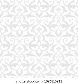 Vintage abstract floral seamless pattern. Intersecting stylized leaves, branches and scrolls forming abstract floral rapport in Arabic style. Arabesque design. Monochrome white background.