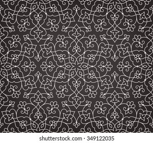 Vintage abstract floral seamless pattern. Intersecting curved elegant stylized leaves and scrolls forming abstract floral ornament in Arabic style. Arabesque.
