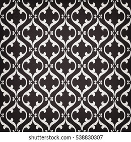 Vintage abstract floral seamless pattern. Intersecting curved elegant stylized leaves and scrolls forming grey ornament on black background in Arabic style. Decorative Moroccan lattice.