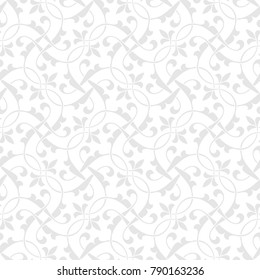 Vintage abstract floral seamless pattern. Intersecting curved elegant stylized leaves and scrolls forming abstract floral background in Arabic style. Arabesque design.