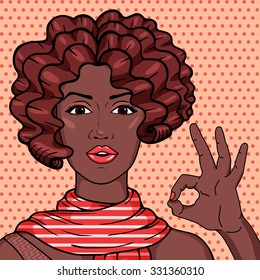 Vintage african american woman showing OK gesture pop art comic style illustration. Vector afro girl with brown curly hair in scarf.