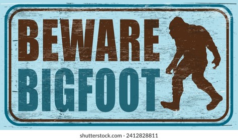 Vintage aged and worn bigfoot sign on wood