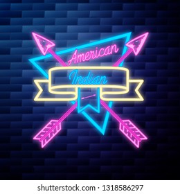 Vintage american indian emblem glowing neon sign on brick wall background