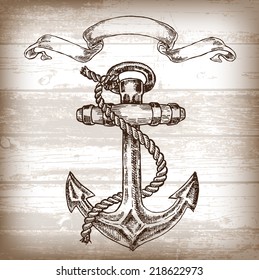 Vintage anchor on wooden background. Hand drawn vector illustration