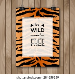 Vintage Animal Skin Background and Typography Design. Vector illustration. Poster with Slogan and Tiger Pattern on Wood Hanging on Paper Clips. Inspirational Quote Be Wild and Free