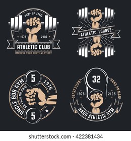 Vintage athletic logos - hand with dumbbell and kettlebell on a black background.