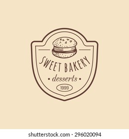 Vintage bakery logo. Vector typographic poster with macaron. Retro emblem sweet cookie. Hipster pastry icon. Biscuit sign. Desert emblem.
