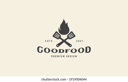 vintage black fire with spatula logo design vector icon symbol illustration