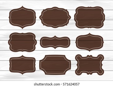 Vintage black frame empty set. Retro premium quality labels set and antique frames design elements on white wooden background. Vector illustration