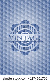 Vintage blue emblem or badge with geometric pattern background.