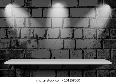 Vintage brick wall with shelf and light