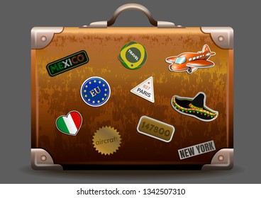 Vintage brown leather suitcase with travel stickers. Realistic travel bag on gray background. Vector illustration.