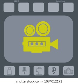 Vintage Camcorder Icon  on a gray cine-film background. flat design style