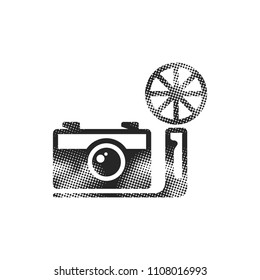 Vintage camera icon in halftone style. Black and white monochrome vector illustration.