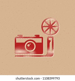 Vintage camera icon in halftone style. Grunge background vector illustration.