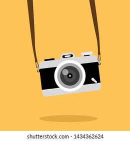 Vintage camera on color background. Retro style toned picture. Minimalistic concept