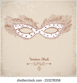 Vintage Card with festive venetian mask decorated with feathers