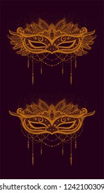 Vintage carnival mask with feathers. orange drawn mask on the dark background.