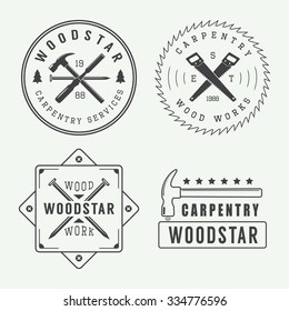 Vintage carpentry or mechanic logo, emblem, badge, label and watermark with saws, hammers, chisels, nails,trees and stars int retro style. Vector illustration 