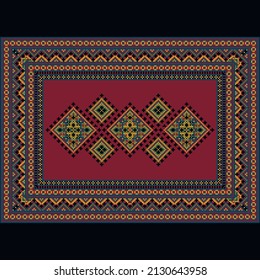 Vintage carpet in red tones with a patterned border around the edges and a red center with patterned rhombuses in black, bluish, yellow and gray tones on a black background
