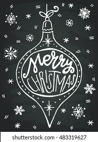 Vintage Christmas bauble with hand drawn snowflakes on the chalkboard background and Merry Christmas hand lettering.  Design elements perfect for xmas greeting and invitation cards, flyers and poster.