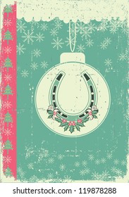 vintage christmas card on old paper background with ball and lucky horseshoe