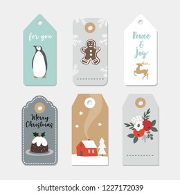 Vintage Christmas gift tags set. Hand drawn labels with winter flowers, fruit, pudding, penguin bird, gingerbread cookie and house. Isolated vector illustration objects.