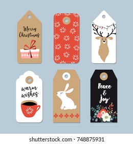 Vintage Christmas gift tags set. Hand drawn labels with bunny, deer, polar bear, cup of coffee and winter flowers. Isolated vector illustration objects.