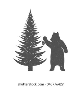 Vintage Christmas and New Year illustration fun bear with grunge effect for posters and t-shirts. Funny bear with Christmas tree on a white background