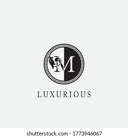 Vintage Circle M Letter  Logo Icon. Classy Ornate Leaf Shape design on black and white color for business initial  like fashion, Jewelry, Beauty Salon, Cosmetics, Spa, Hotel and Restaurant.