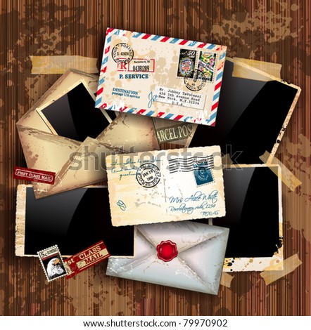 Vintage composition with old style distressed postage design elements and antique photo frames plus some post stickers. Background is wood.