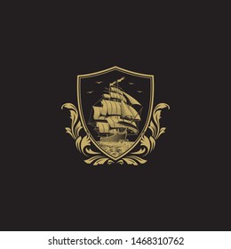 Vintage Crest with Majestic Sail Ship. Barbary Corsair Boat Ship in Classic Elegant Shield Style Cress with Gold on Black Background. 