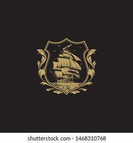 Vintage Crest with Majestic Sail Ship. Barbary Corsair Boat Ship in Classic Elegant Shield Style Cress with Gold on Black Background. 