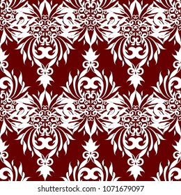 Vintage damask seamless pattern. Vector floral red background. Hand drawn antique style white damask ornaments, leaves, swirls, flowers. Ornate elegant design for wallpapers, fabric, prints, textile