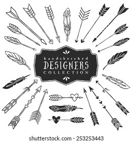 Vintage decorative arrows and feathers collection. Hand drawn vector design elements.