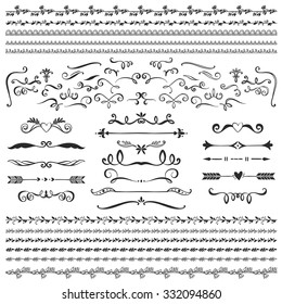 Vintage decorative curls and swirls collection. Hand drawn vector design elements on blackboard.